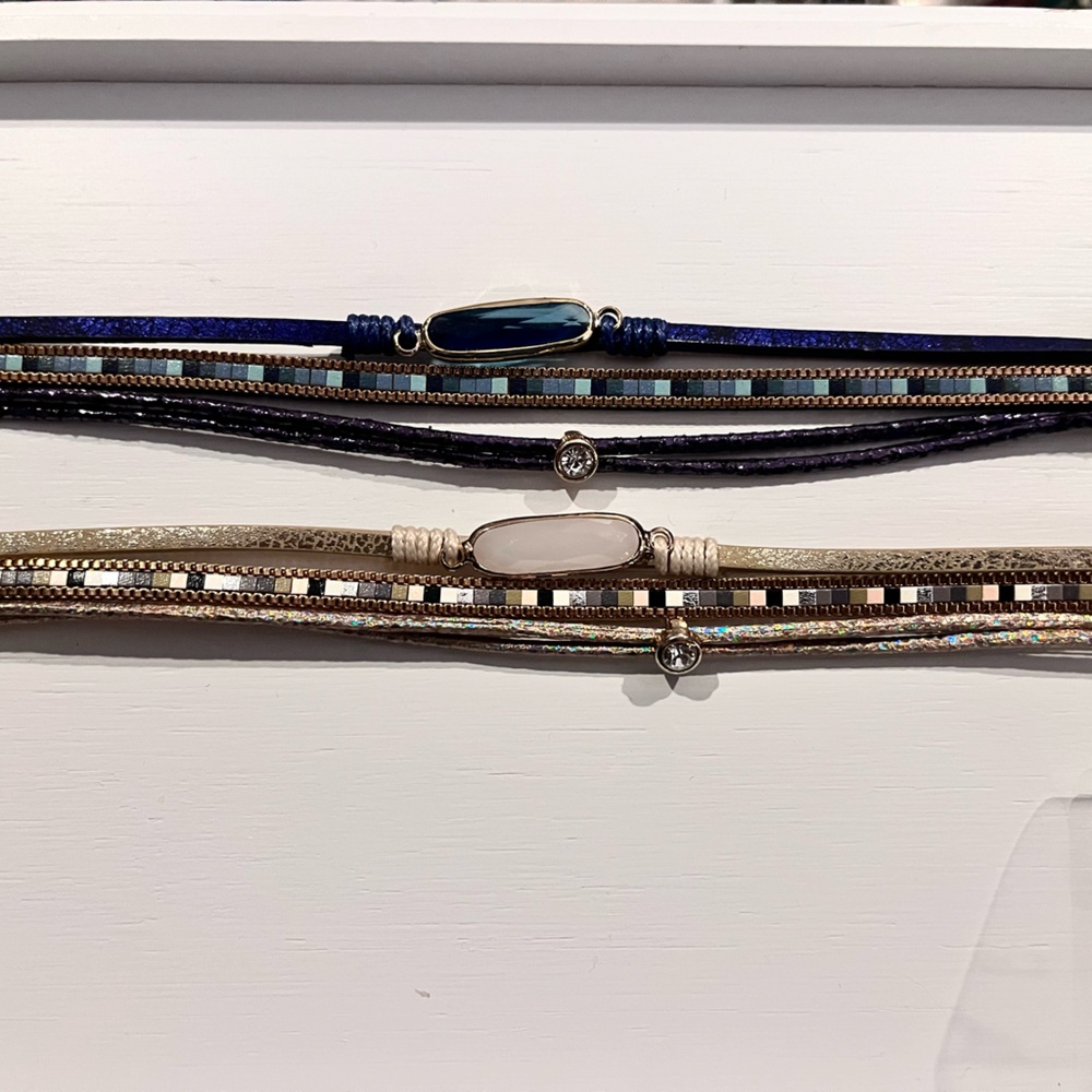 Pair of multi strand leather and jewel bracelets. Navy gold